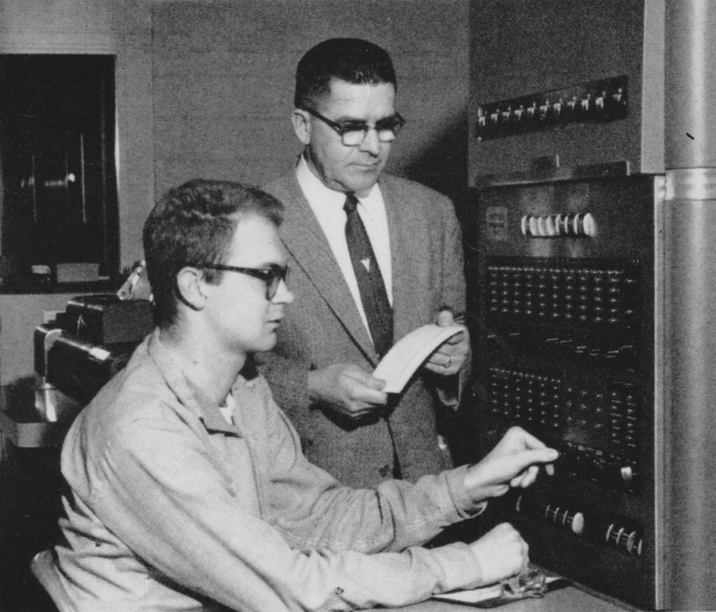 Picture of Donald Knuth at IBM 650 console 1960